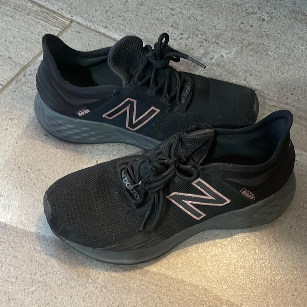 Black and rose gold New Balance running shoes